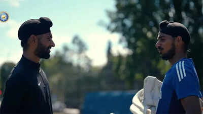 Harpreet Brar and Arshdeep Singh share a light moment during practice.