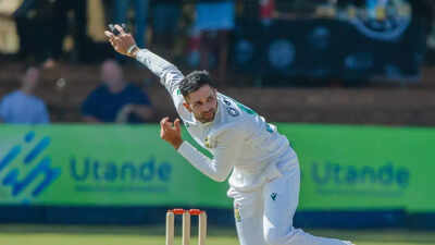 Keshav Maharaj celebrates taking a wicket against Zimbabwe