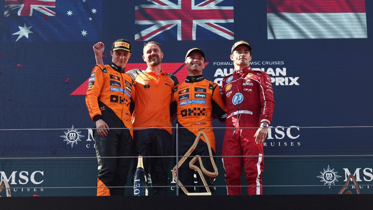 Lando Norris and Oscar Piastri celebrate their podium finishes alongside Charles Leclerc