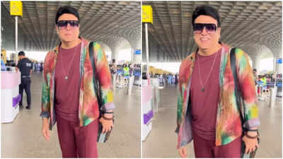 Govinda's colourful style makes a COMEBACK in this latest airport appearance as wife Sunita Ahuja quashes divorce rumors - Watch
